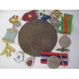 A selection of medals and badges to include a death plaque named Edwin George Bullock, Defence and