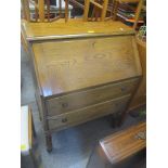 An early 20th century oak bureau fall flap above two drawers and barley twist supports, 98cm h x