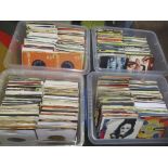 Four crates of assorted 7" singles