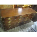 A reproduction mahogany military style sideboard having nine inset drawers on a plinth base 71cm h x