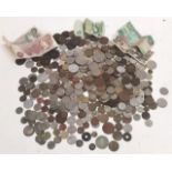 A mixed lot of coins and banknotes from around the world to include early/mid 20th century British