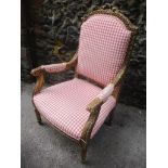 A 20th century gilt gesso framed open armchair with acanthus ornament, upholstered back and seat