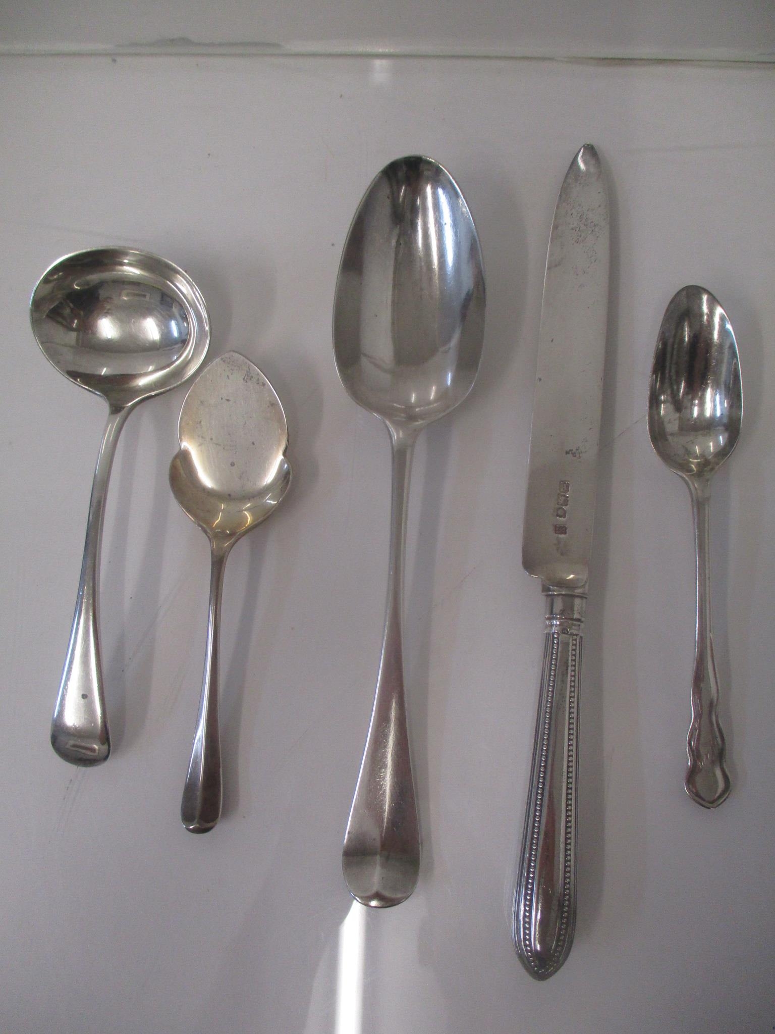 Mixed 19th and 20th century silver to include a preserve spoon, a sauce ladle, a serving spoon and a