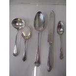 Mixed 19th and 20th century silver to include a preserve spoon, a sauce ladle, a serving spoon and a