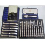 A selection of cased silver flatware to include a christening spoon, set of six cocktail sticks with