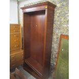 A reproduction mahogany bookcase having a stepped dental moulded cornice and four loose shelves