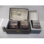 A pair of silver napkin rings, boxed, a napkin ring box and a thimble, 65g