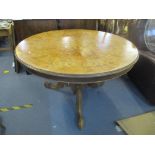 A reproduction of a 19th century walnut and marquetry breakfast table, circular snap top on c turned