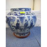 A 20th century Chinese blue and white vase in bulbous form depicting images of huntsmen and
