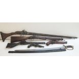 A group of replica decorative antique weapons to include a wheel-lock musket, flint-lock pistols and