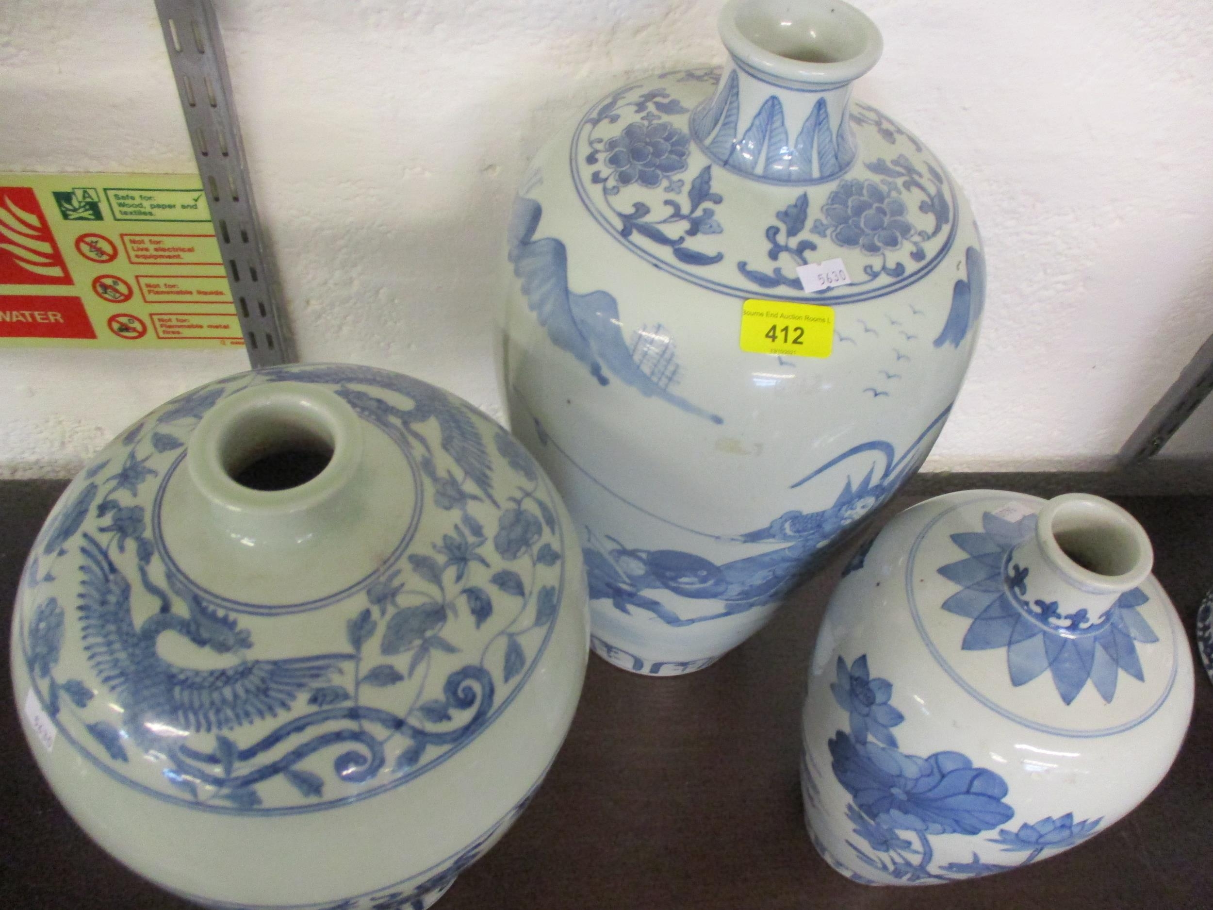 A group of three 20th century Chinese blue and white vases in varying sizes and colours, the tallest - Image 5 of 9