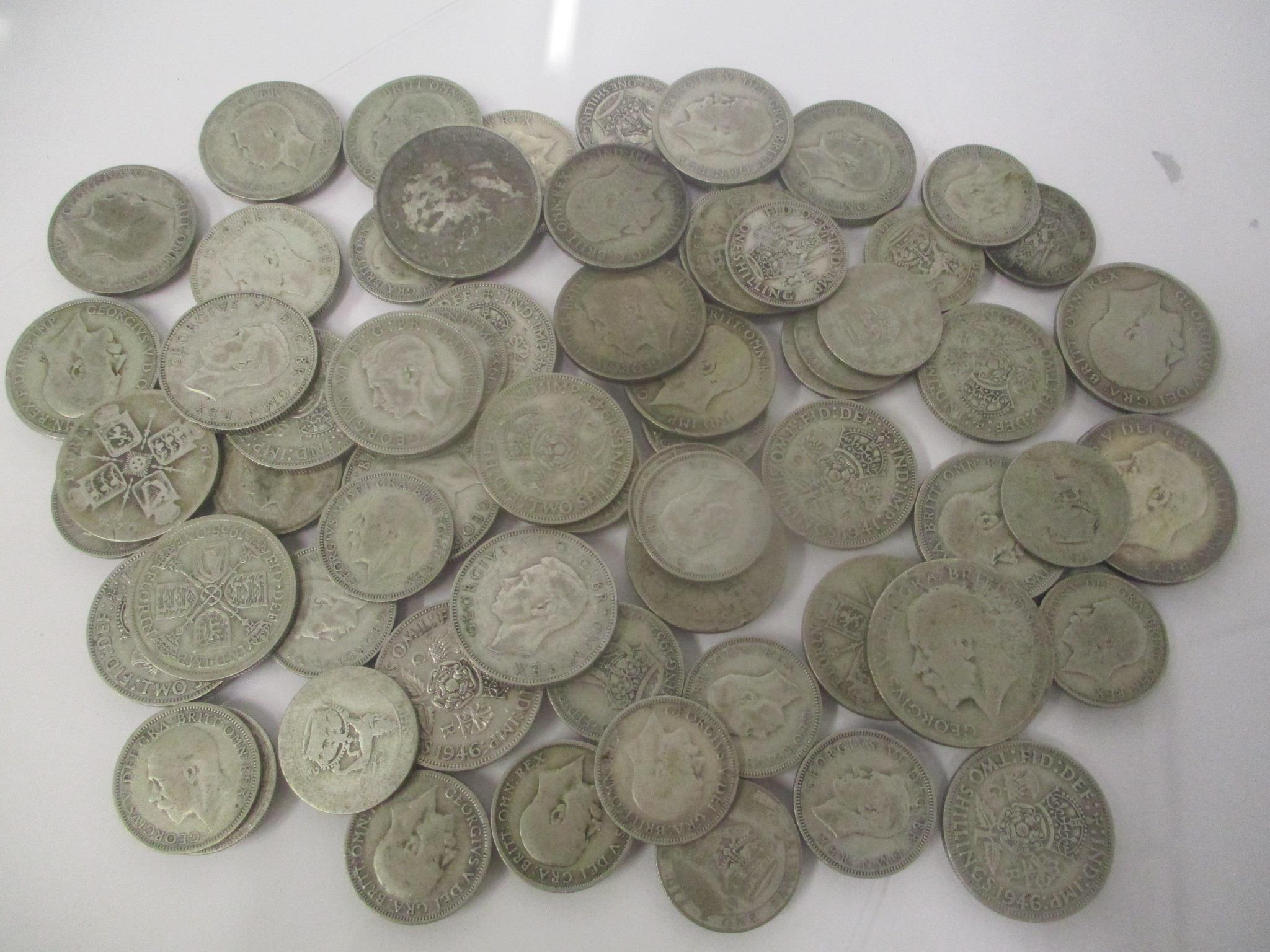 A collection of pre 1947 silver coins to include four half crowns, thirty florins and one