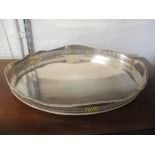 An oval galleried silver plated twin handled tray with rope twist rim Location: