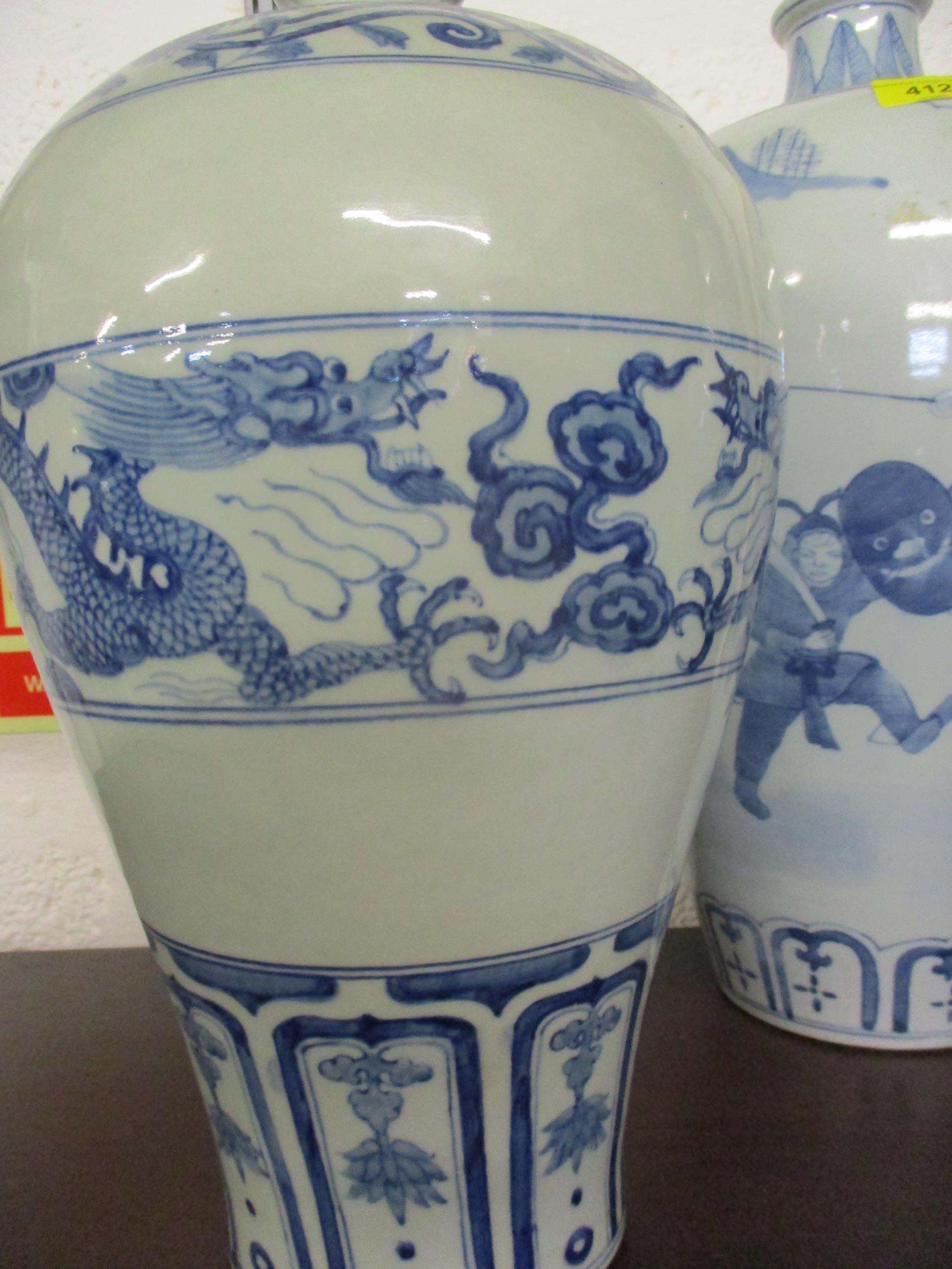 A group of three 20th century Chinese blue and white vases in varying sizes and colours, the tallest - Image 4 of 9