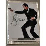 Seven photographs of actors, some signed, to include Roger Moore, Pierce Brosnan, George Lazenby and