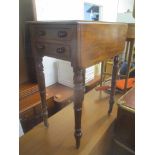 An early 19th century mahogany work table having two inset drawers and turned legs, 75.5cm h x