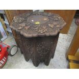 An early 20th century Burmese hardwood carved octagonal occasional table 62.5cm h x 58cm w