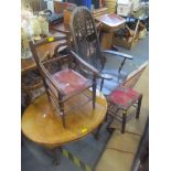 Two chairs to include a dark beech stained spindle back rocking chair and a child's chair together