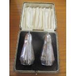 A pair of cased early 20th century silver salt shakers 91.2g