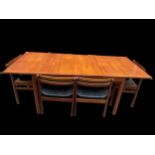 A White & Newton 1960s teak extending dining table and six matching dining chairs, the dining