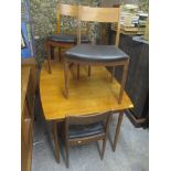 A mid 20th century retro teak extending dining table together with four matching chairs, 74cm h x