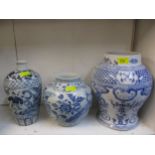 A group of three 20th century Chinese blue and white vases in varying sizes, shapes and colours