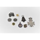 A group of late 19th/early 20th century military badges, medals and buttons to include a Kabul to