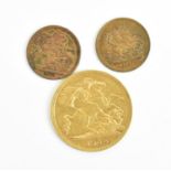 A Victorian half sovereign minted London 1900, together with two miniature Spielgeld tokens, one