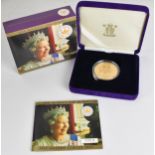 A boxed Royal mint 2002 Queen Elizabeth II 22ct gold proof five pound coin together with