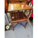 An early 20th century mahogany revolving bookcase on static square formed base, above cabriole legs,