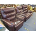 A burgundy leather electrical reclining two-seater sofa and matching armchair Location: CR