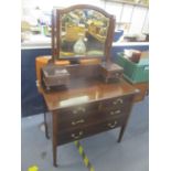 An Edwardian inlaid mahogany dressing table with a swing mirror and drawers, on square, tapered