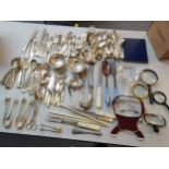 A quantity of silver plated flatware, together with magnifying glasses, Location: CF