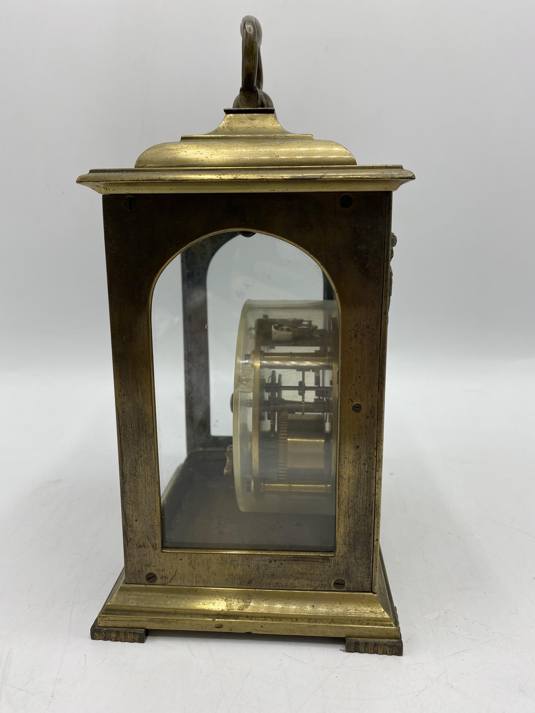 A late 19th century brass cased mantle clock having a silvered dial with Roman numerals with pierced - Image 4 of 4