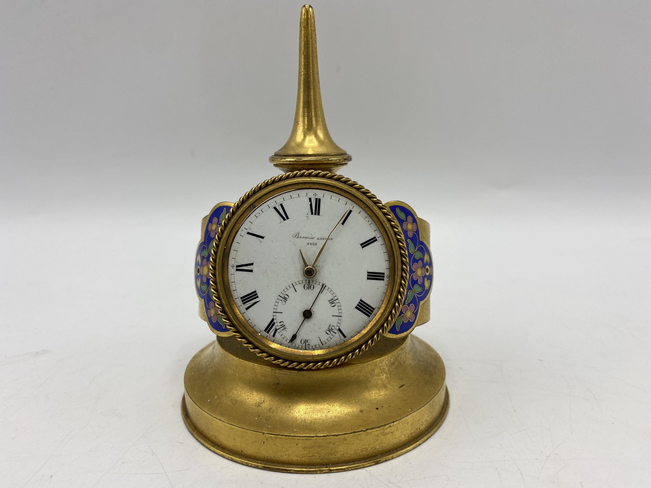 A late 19th century French unusual clock fashioned as a wristwatch, the dial and movement signed '