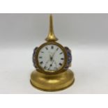 A late 19th century French unusual clock fashioned as a wristwatch, the dial and movement signed '