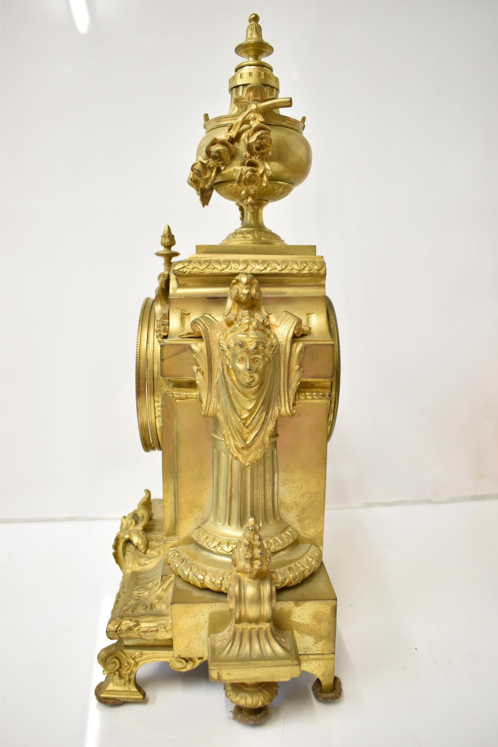 A 19th century French gilt metal mantel clock, the case having an urn shaped finial with floral - Image 4 of 6