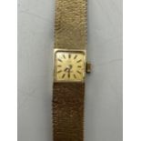 An Omega 1960/70s ladies 9ct gold manual wind wristwatch, the square gilt dial having baton