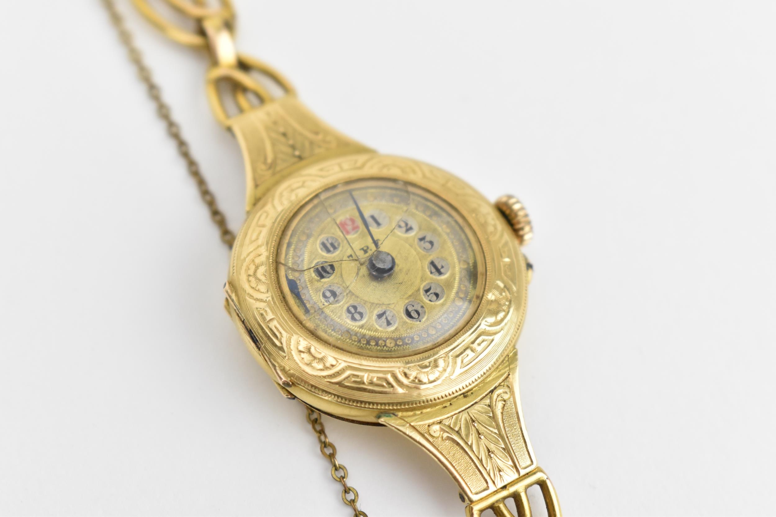 A Swiss early 20th century ladies 18ct gold cylinder wristwatch. The dial signed T.R.F with