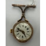 A Victorian Russel & Fils ladies fob watch brooch retailed by J.F Bautte & Co, the yellow metal case