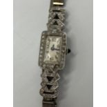 An Art Deco ladies platinum manual wind diamond cocktail watch, the silvered dial having Arabic
