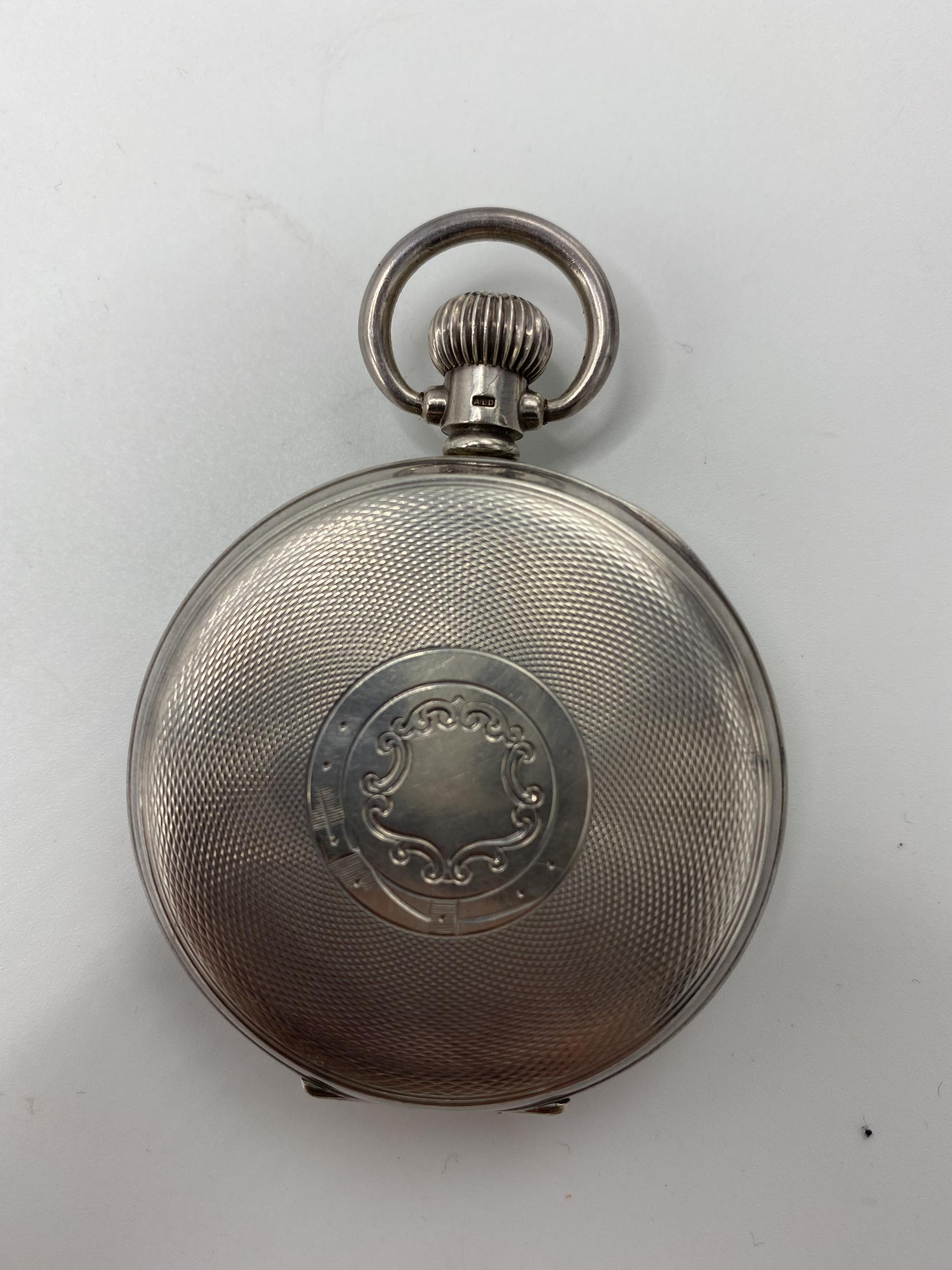 An early 20th century silver open faced keyless wound pocket watch, the white enamel dial signed ' - Image 2 of 6