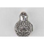 A Victorian silver cased scent bottle, Chester 1899 by Berthold Muller, with a hinged clap and body,