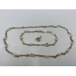 A 9ct gold chain and hoop link necklace having fifteen inset pearls together with a matching 9ct