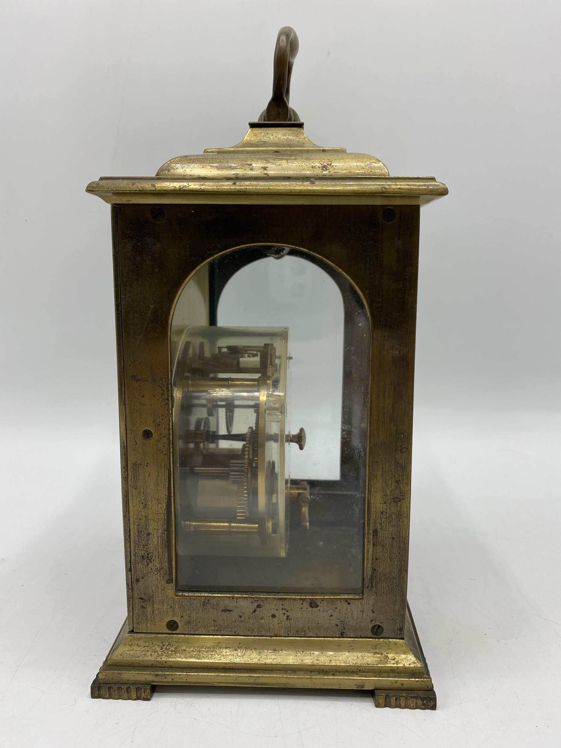 A late 19th century brass cased mantle clock having a silvered dial with Roman numerals with pierced - Image 2 of 4