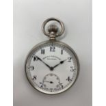 An early 20th century silver open faced keyless wound pocket watch, the white enamel dial signed '