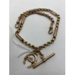 An early 20th century 9ct gold T-bar pocket watch chain with attached 9ct gold horse shoe shaped