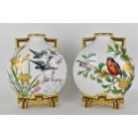 A pair of 19th century Royal Worcester porcelain moon flask vases, hand painted with flora and