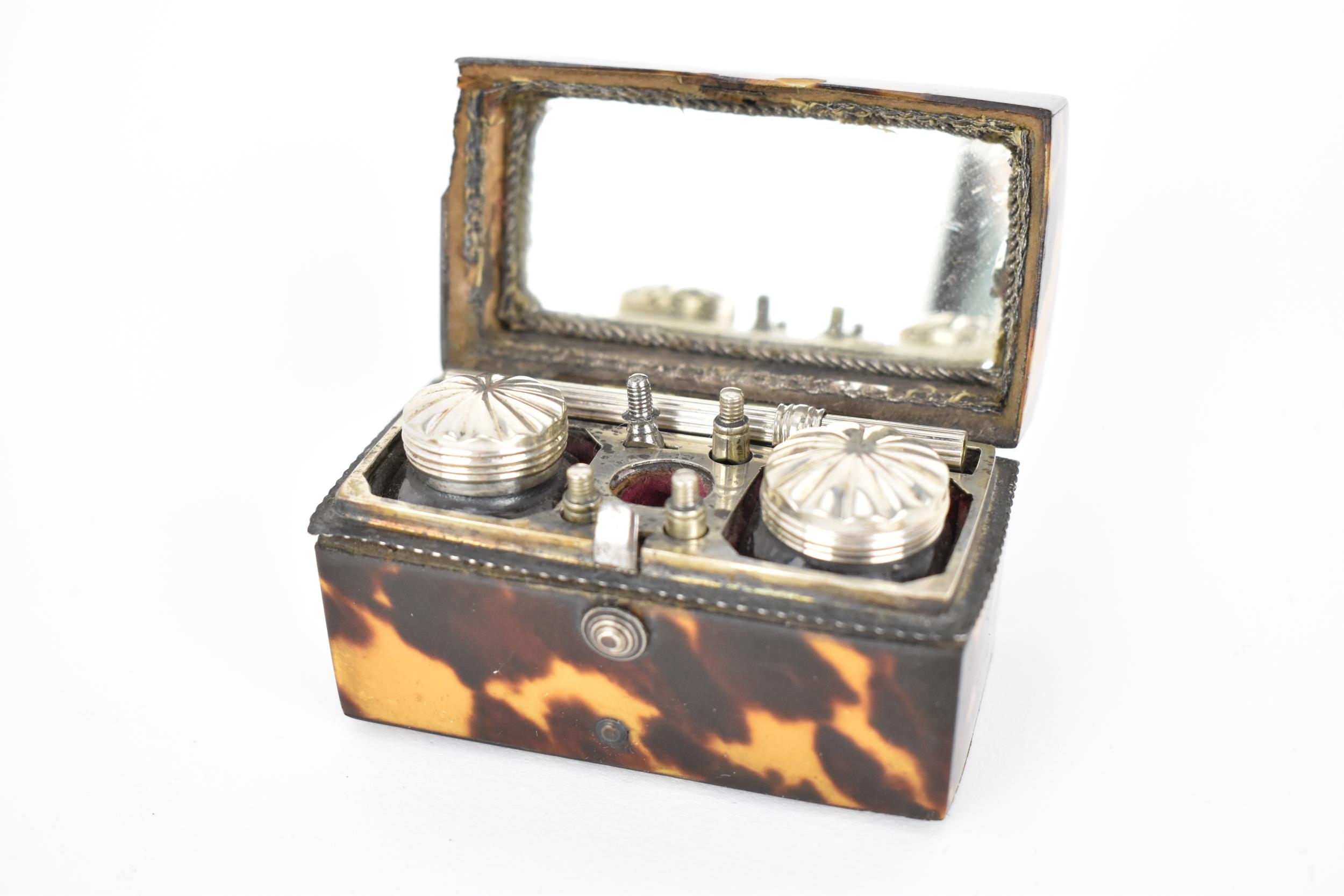 A 19th century tortoise shell cased travellers pen set, the arched topped box enclosing two