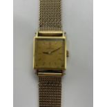 An Omega vintage ladies 18ct and 9ct yellow gold 'ladymatic' automatic wristwatch, the square gilt